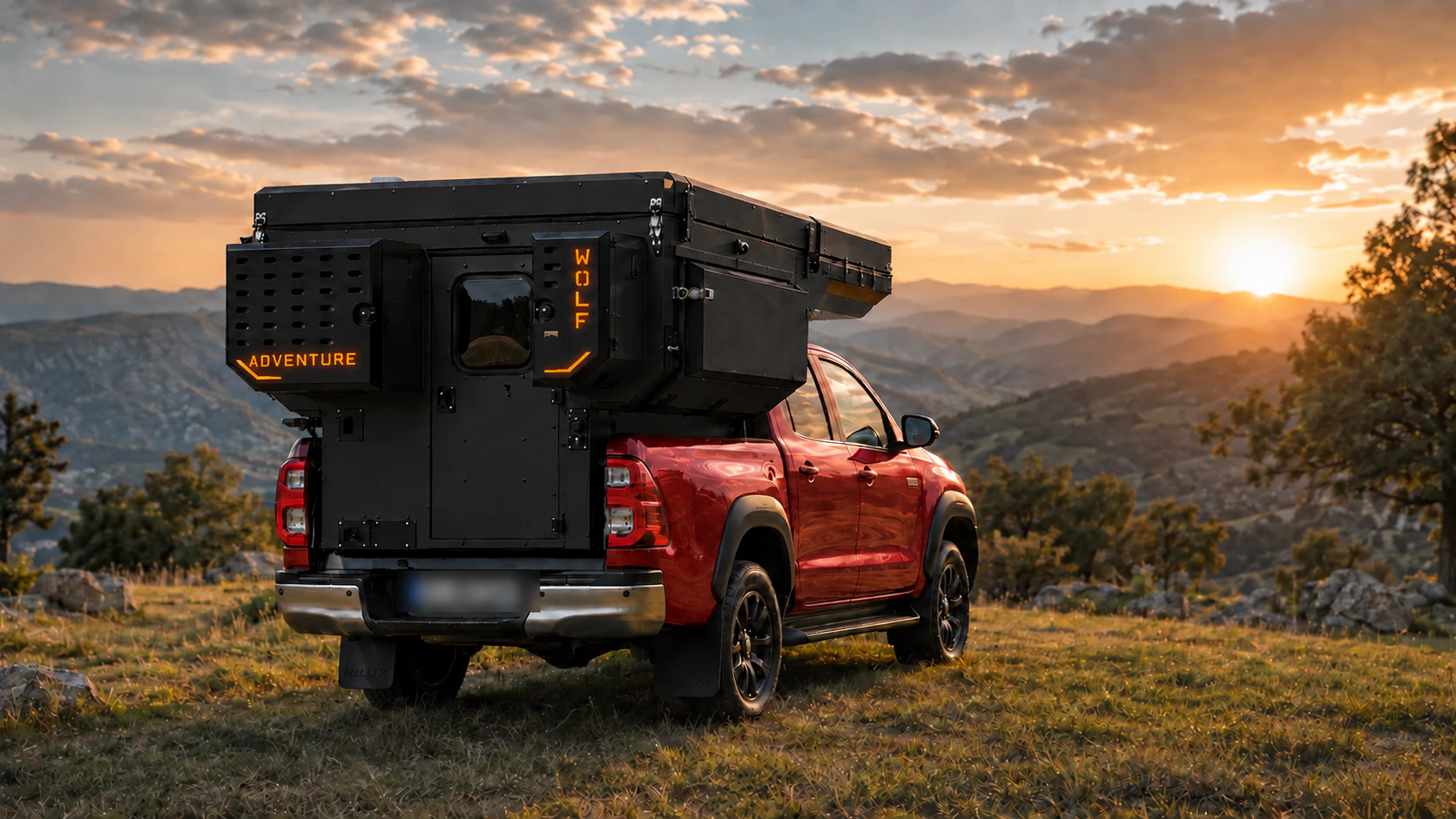 Rear three-quarter view of the Toyota Hilux in red with WOLF ADVENTURE in Matt black.