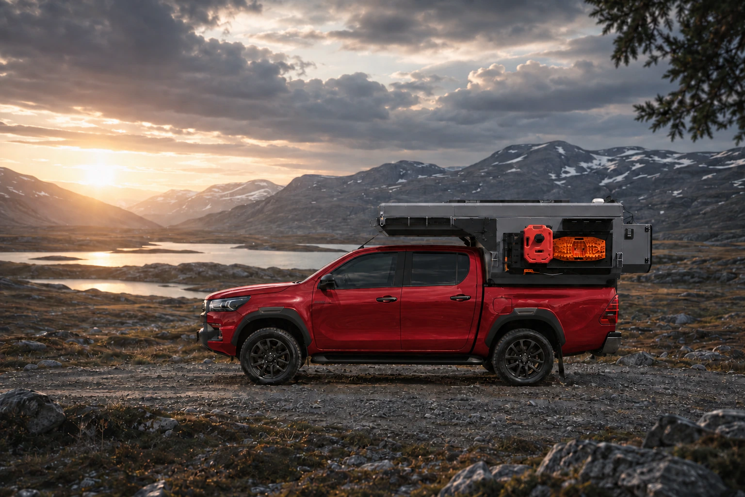 Side view of the Toyota Hilux in red with WOLF ADVENTURE in Mineral grey.