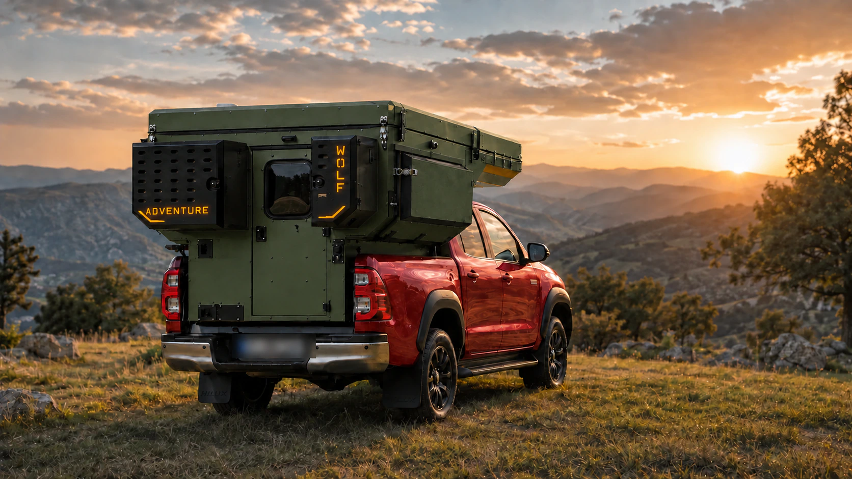 Rear three-quarter view of the Toyota Hilux in red with WOLF ADVENTURE in Tactical olive.