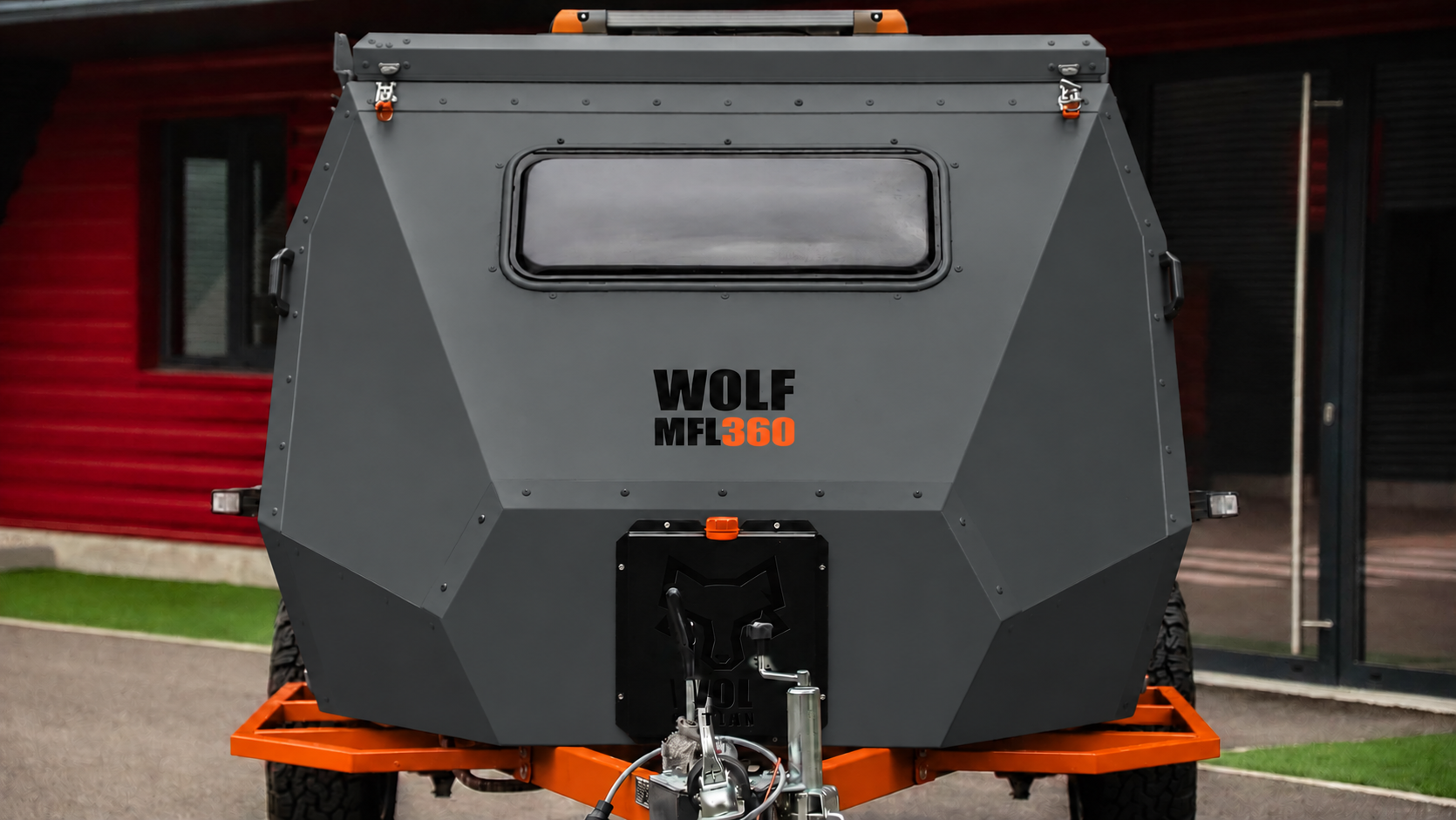 Front view of WOLF MFL 360 caravan in graphite, roof closed.
