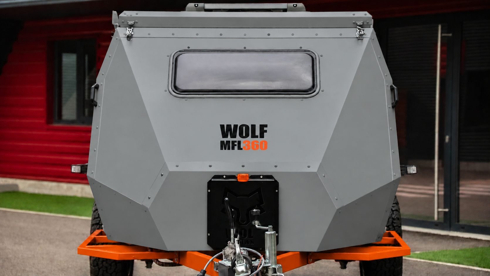 Front view of WOLF MFL 360 caravan in mineral grey, roof closed.