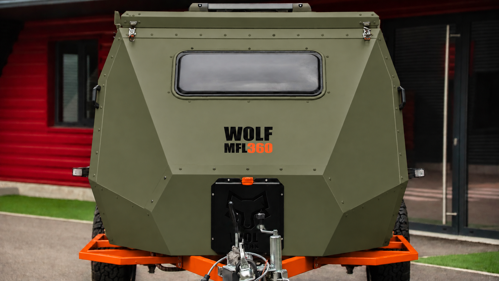Front view of WOLF MFL 360 caravan in tactical olive, roof closed.