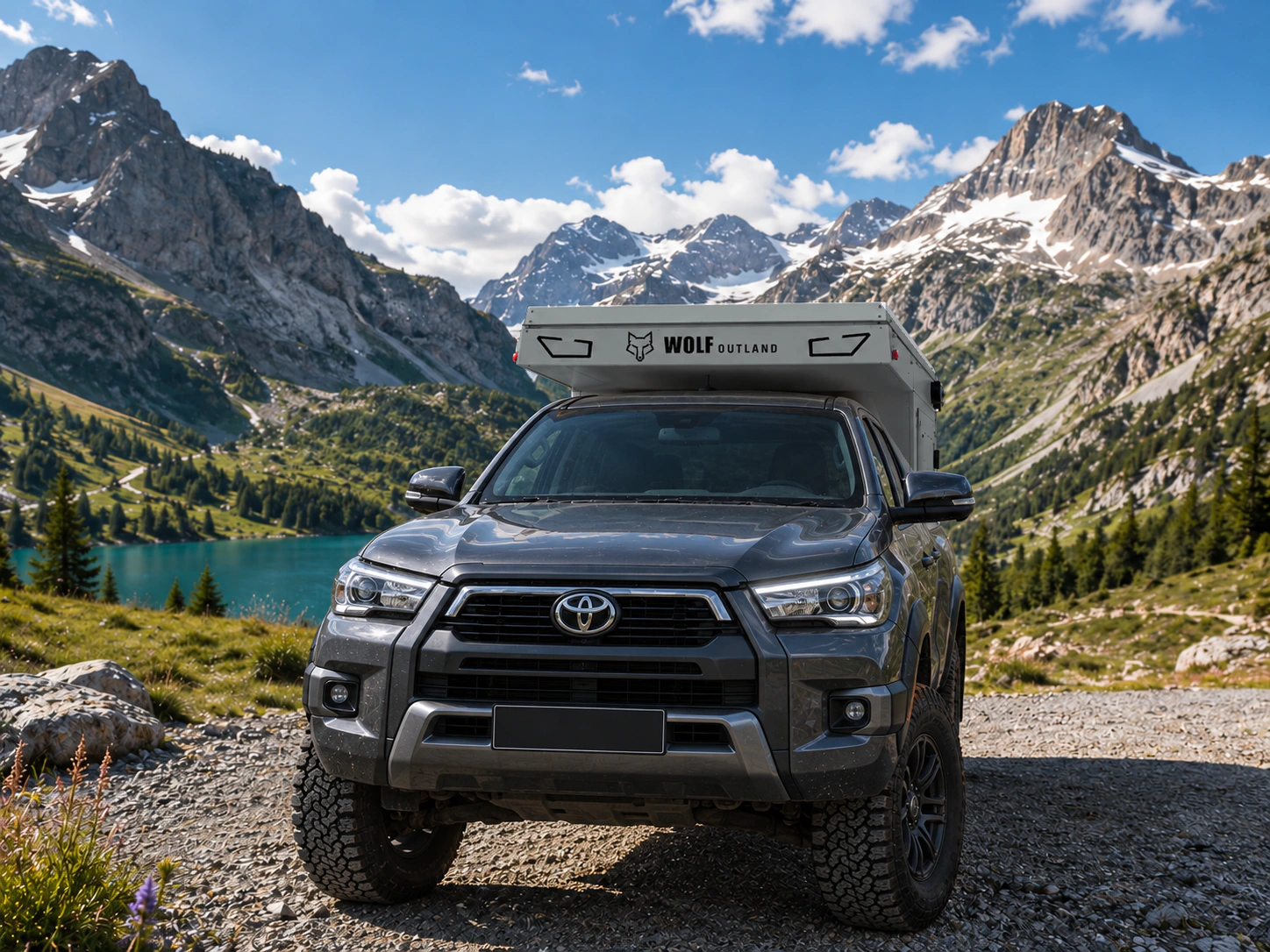 Toyota Hilux in anthracite grey with WOLF XMOD in Mineral grey, two solid rear cabinets — Front view, roof closed, Black engraving.