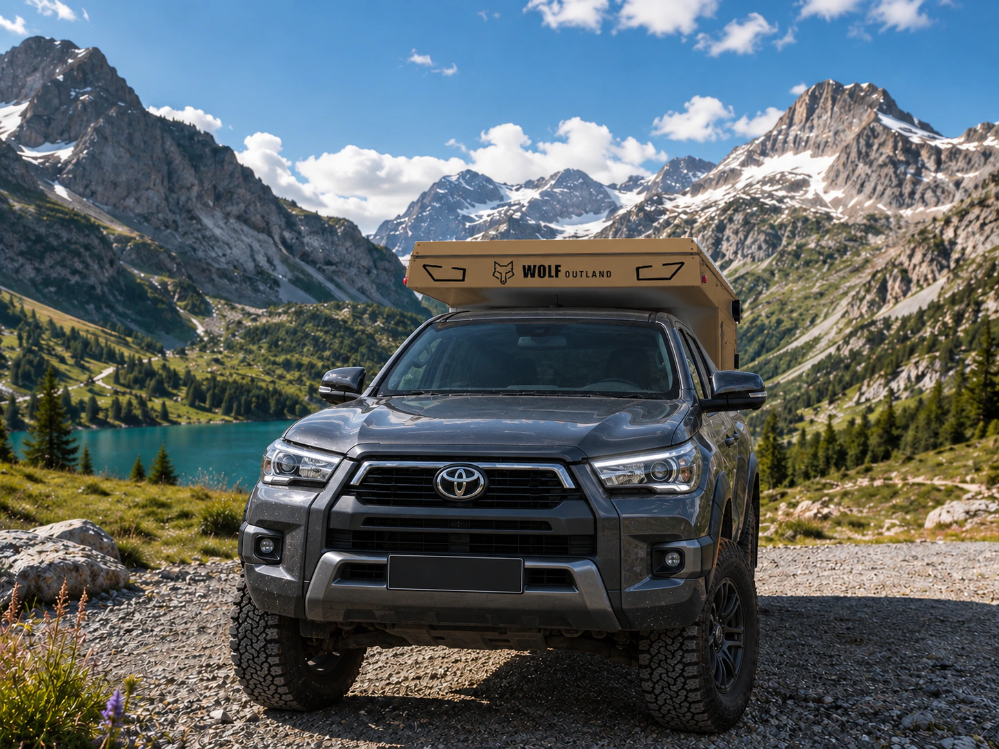 Toyota Hilux in anthracite grey with WOLF XMOD in Bronze, two solid rear cabinets — Front view, roof closed, Black engraving.